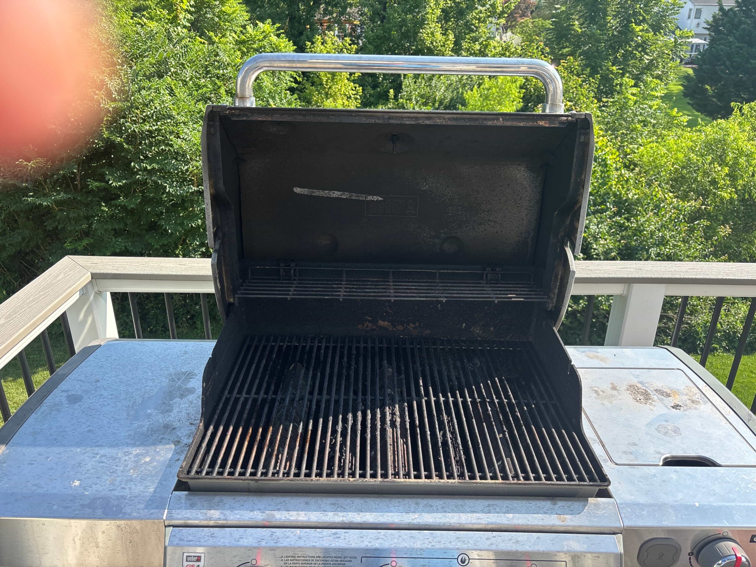 Grill cleaning before — grease and carbon buildup on grates