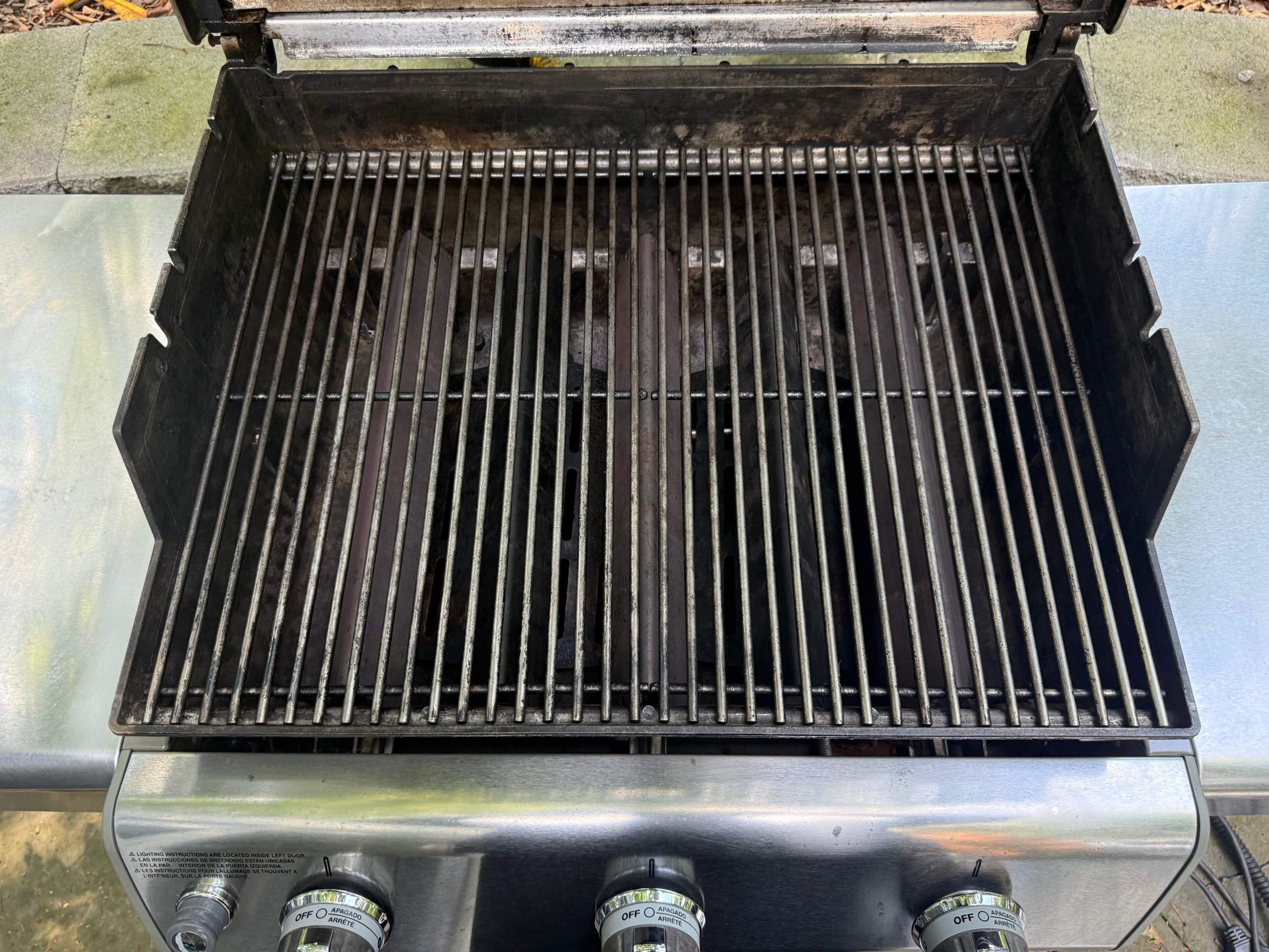 Clean grill grates and burner area after professional grill cleaning in Wayne, PA