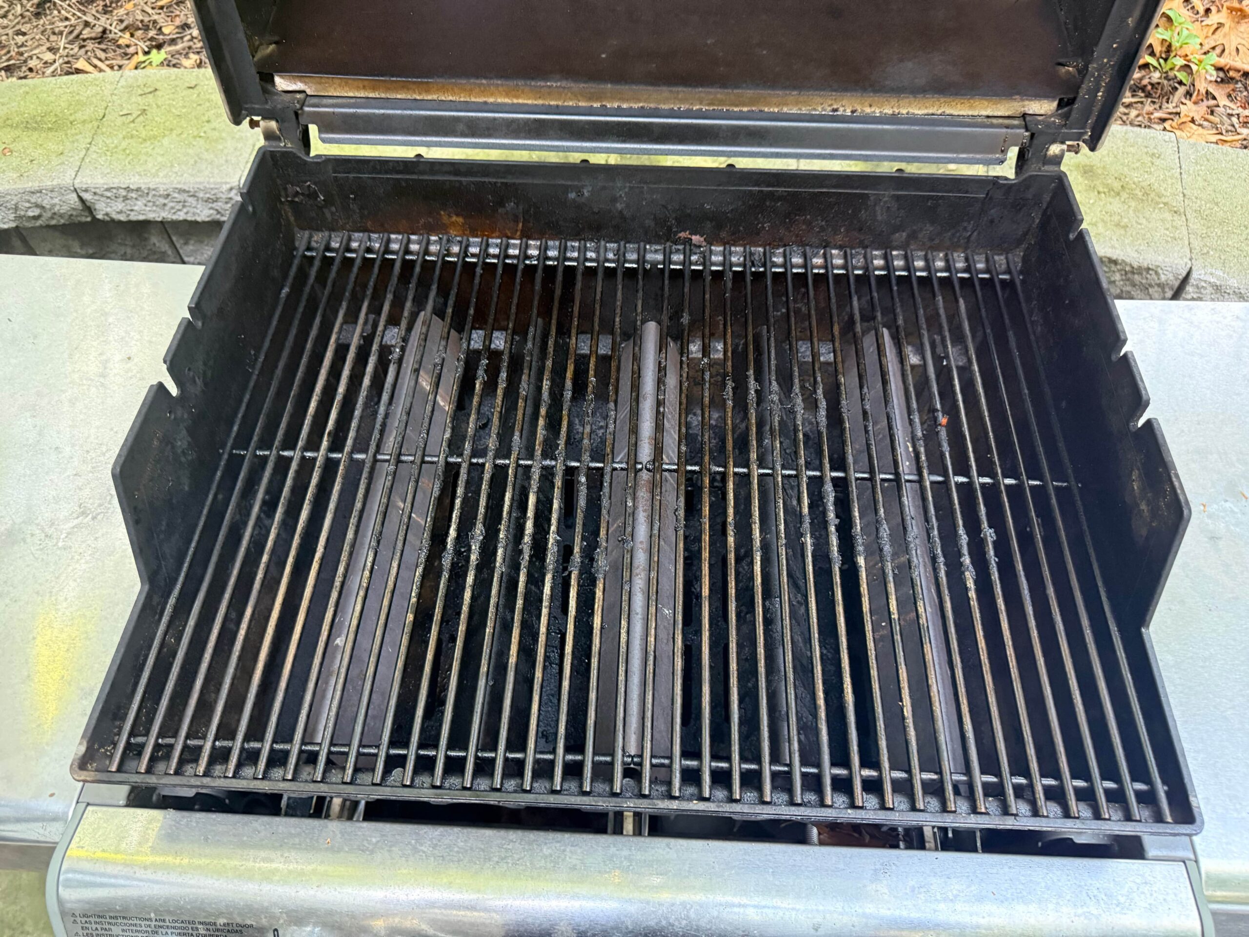 Dirty grill grates with heavy grease and carbon buildup before professional cleaning in Wayne, PA